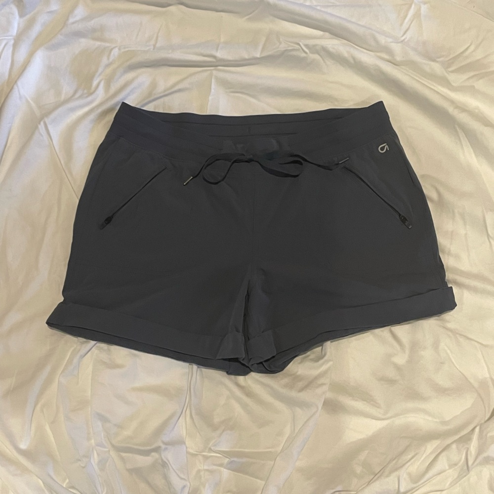 Get fit shorts with pockets and stretch waist. Size large.